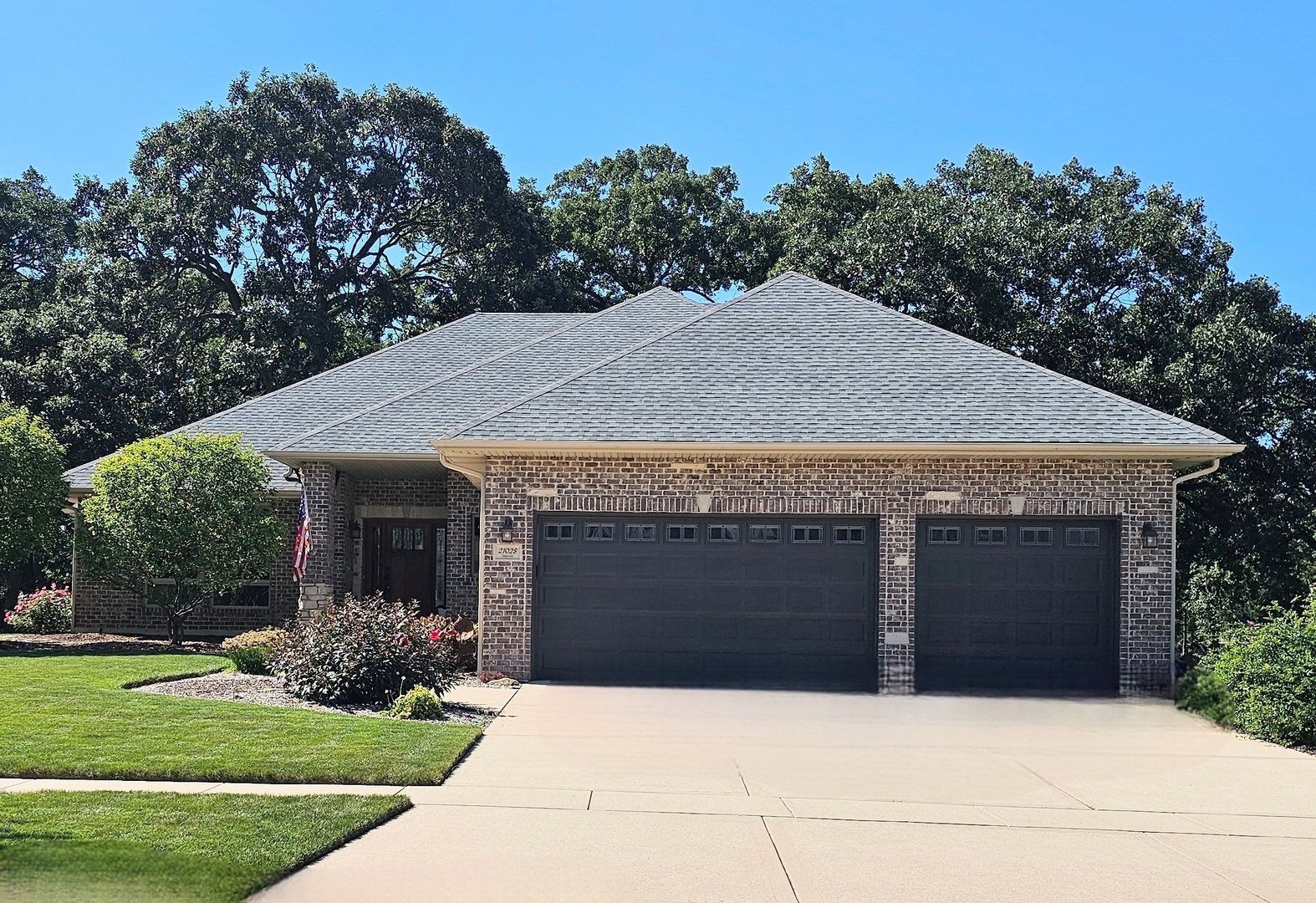 a front view of house with yard garage and green space