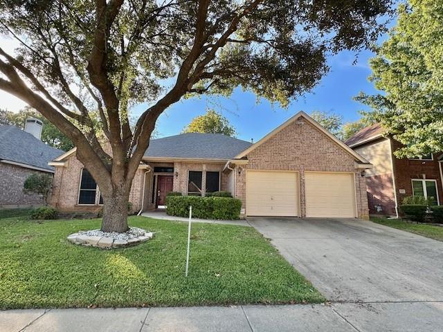 a view of a house with a tree in a yard