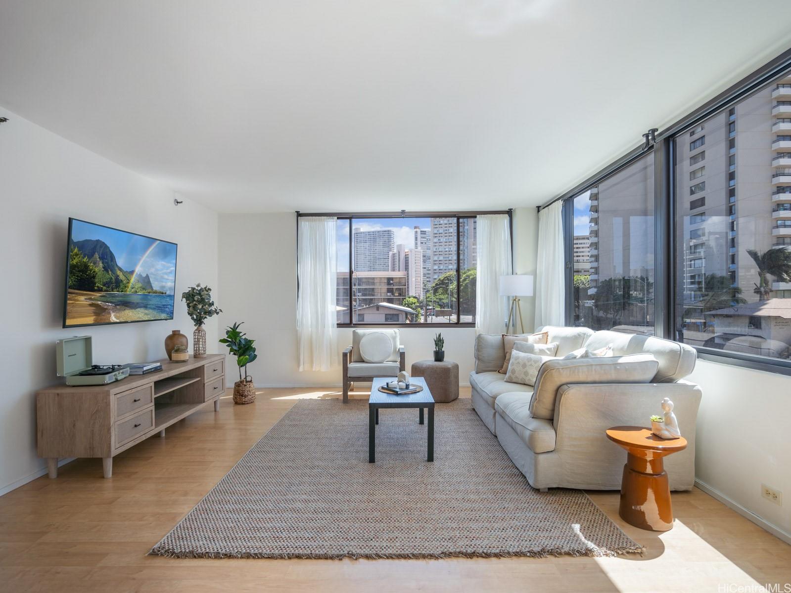 a living room with furniture and a flat screen tv