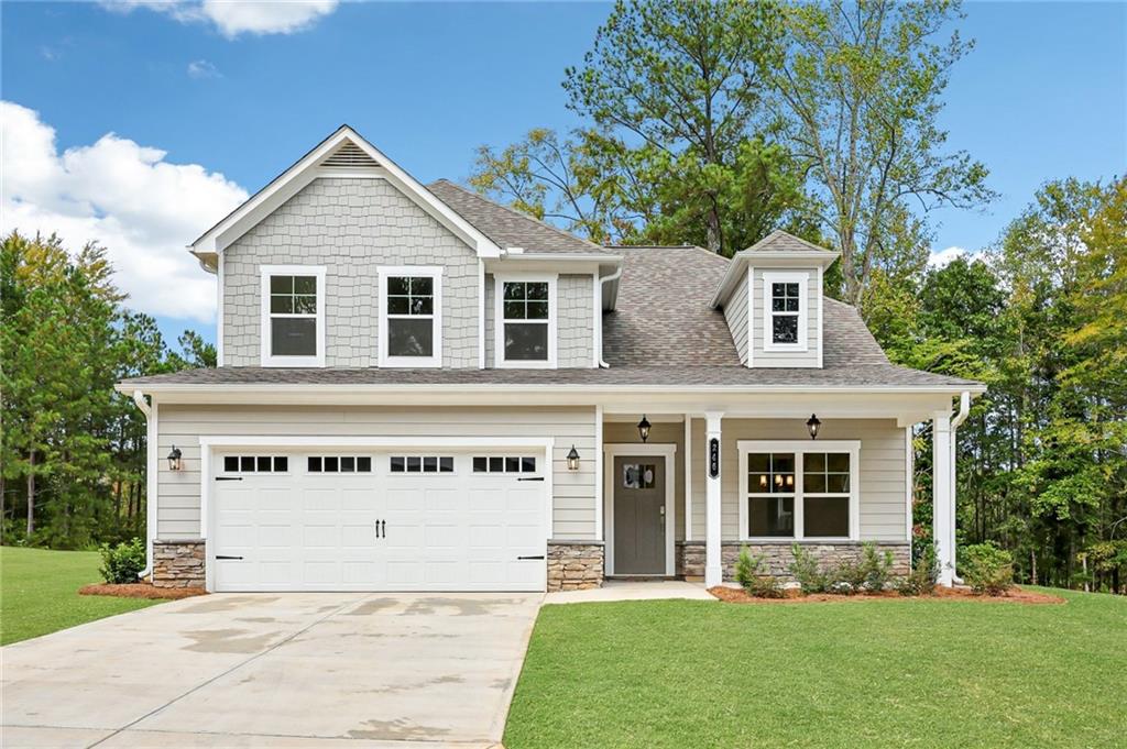 front view of a house with a yard