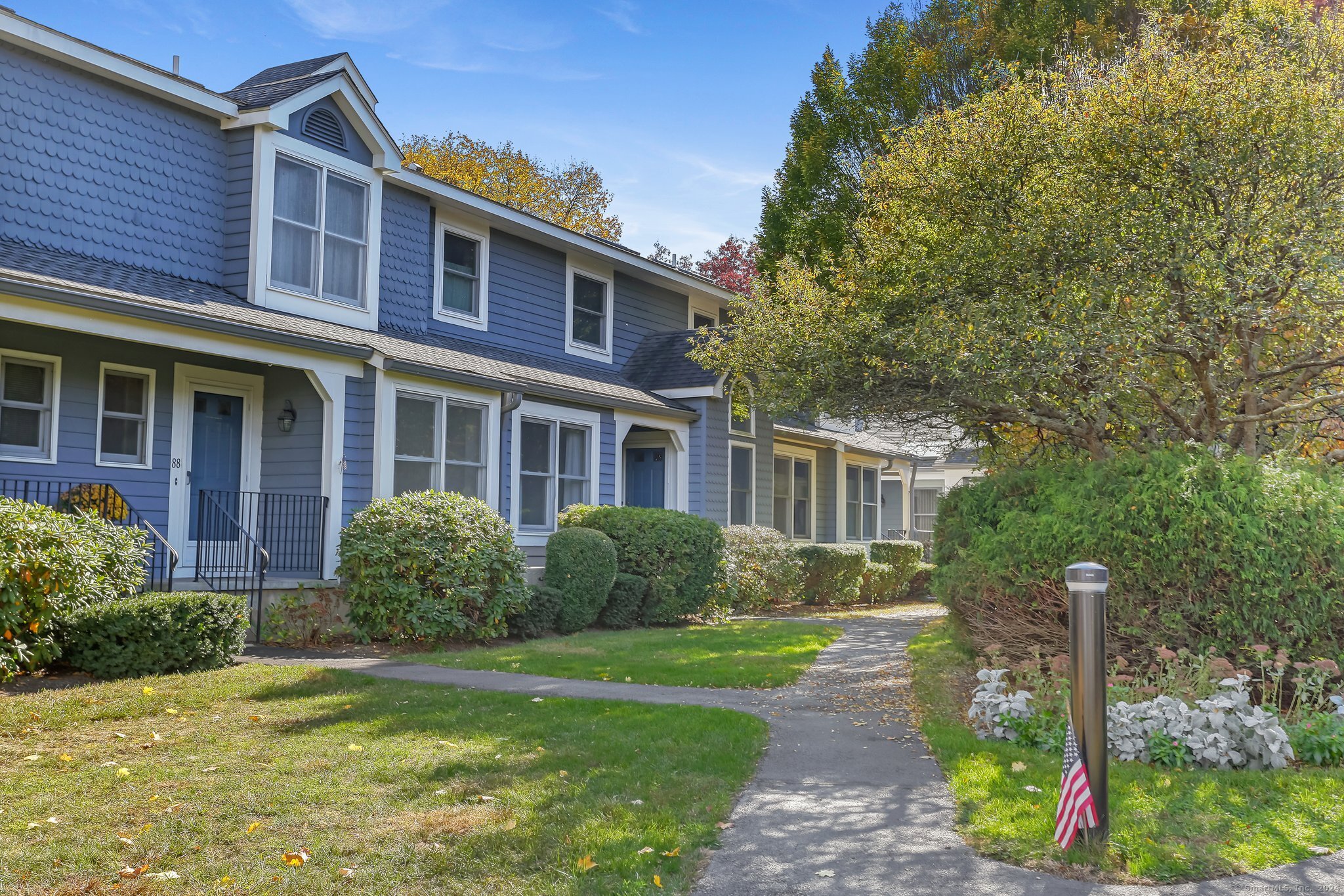 a front view of a house with garden