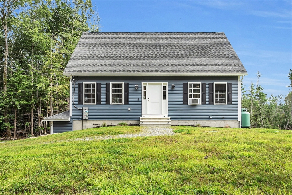 front view of a house with a yard