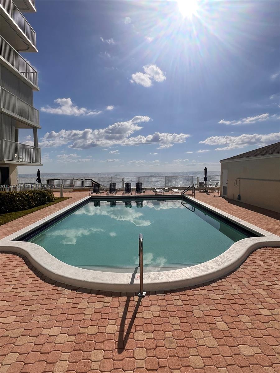 a view of outdoor space yard and swimming pool