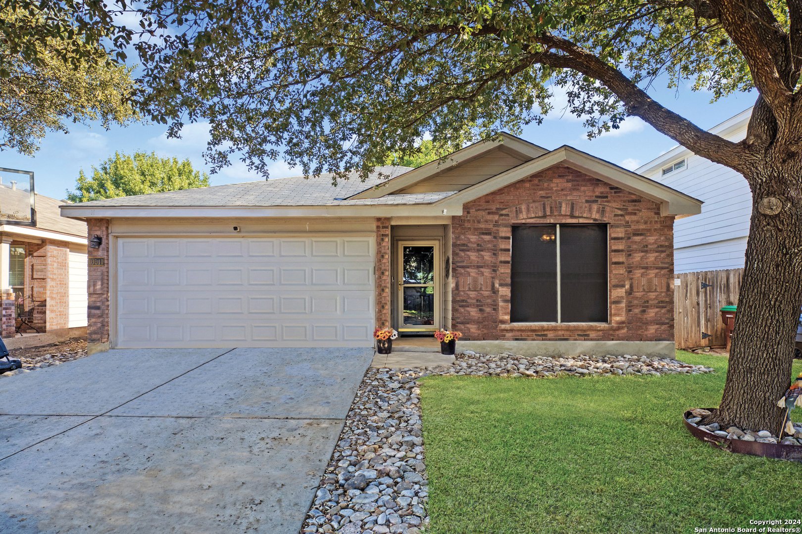 front view of a house with a yard