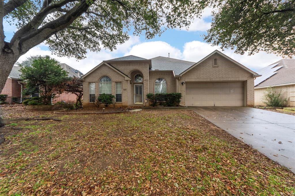 Ranch-style home featuring a garage