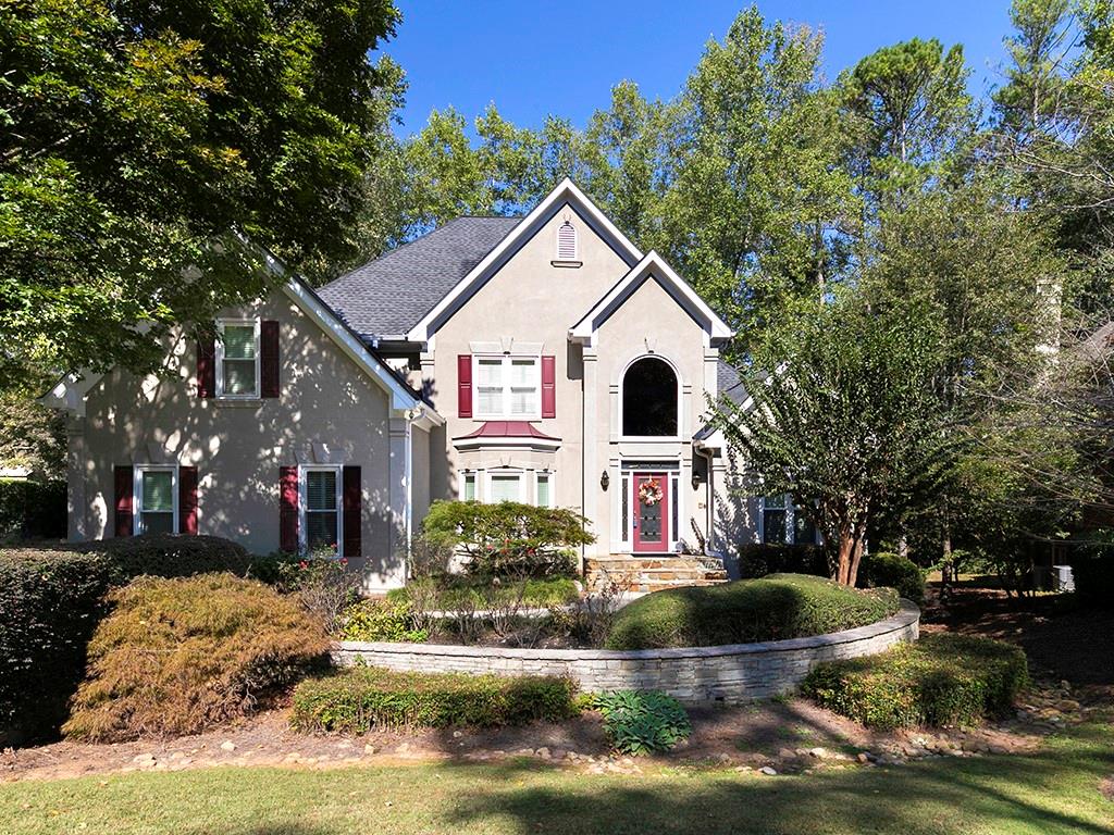 a front view of a house with a yard