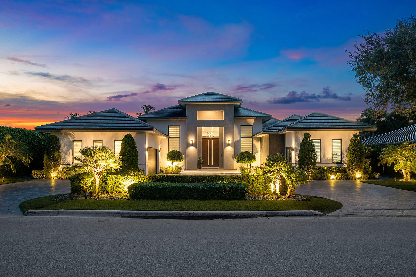 a front view of a house with a yard