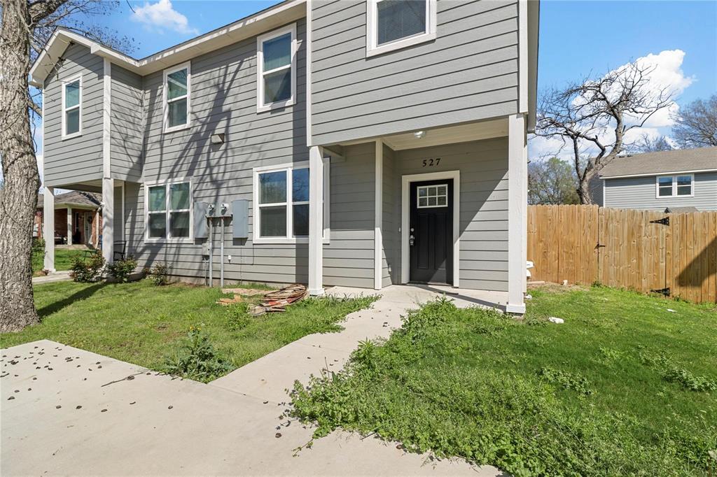 front view of a house with a yard