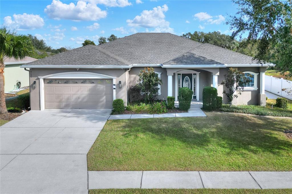 front view of a house with a yard