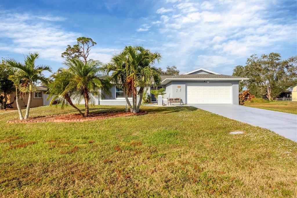 a view of a house with a yard