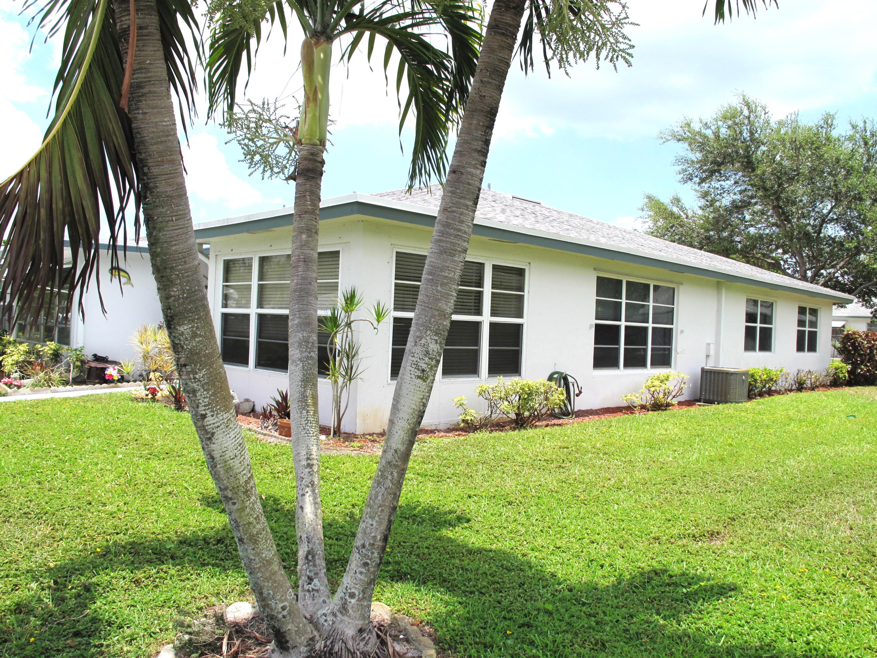 a front view of house with yard patio and green space