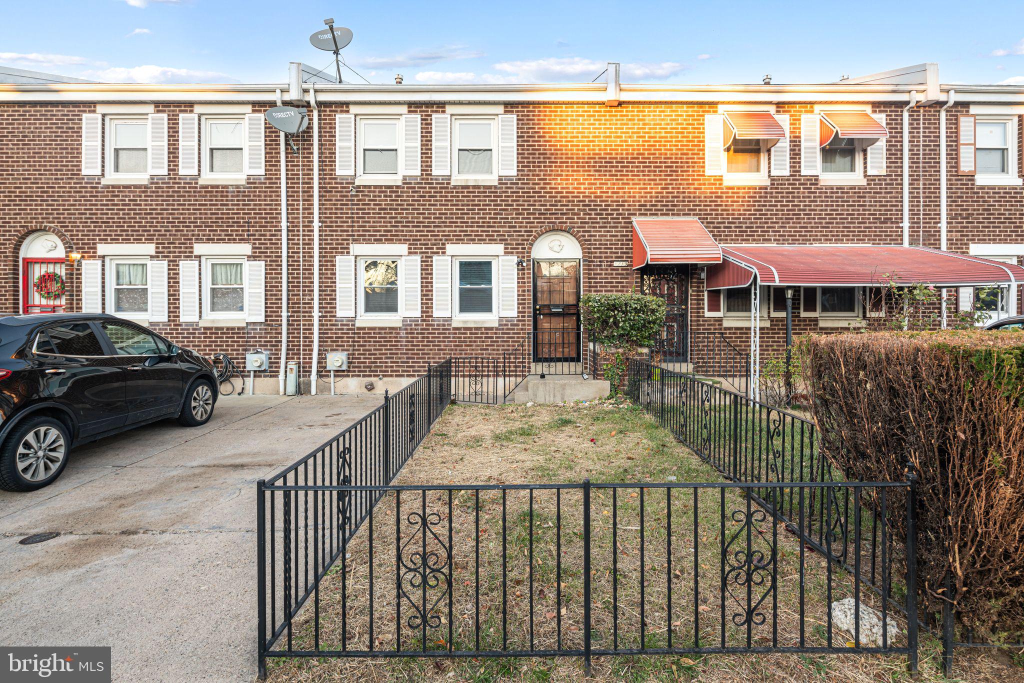 a view of a brick house with many windows