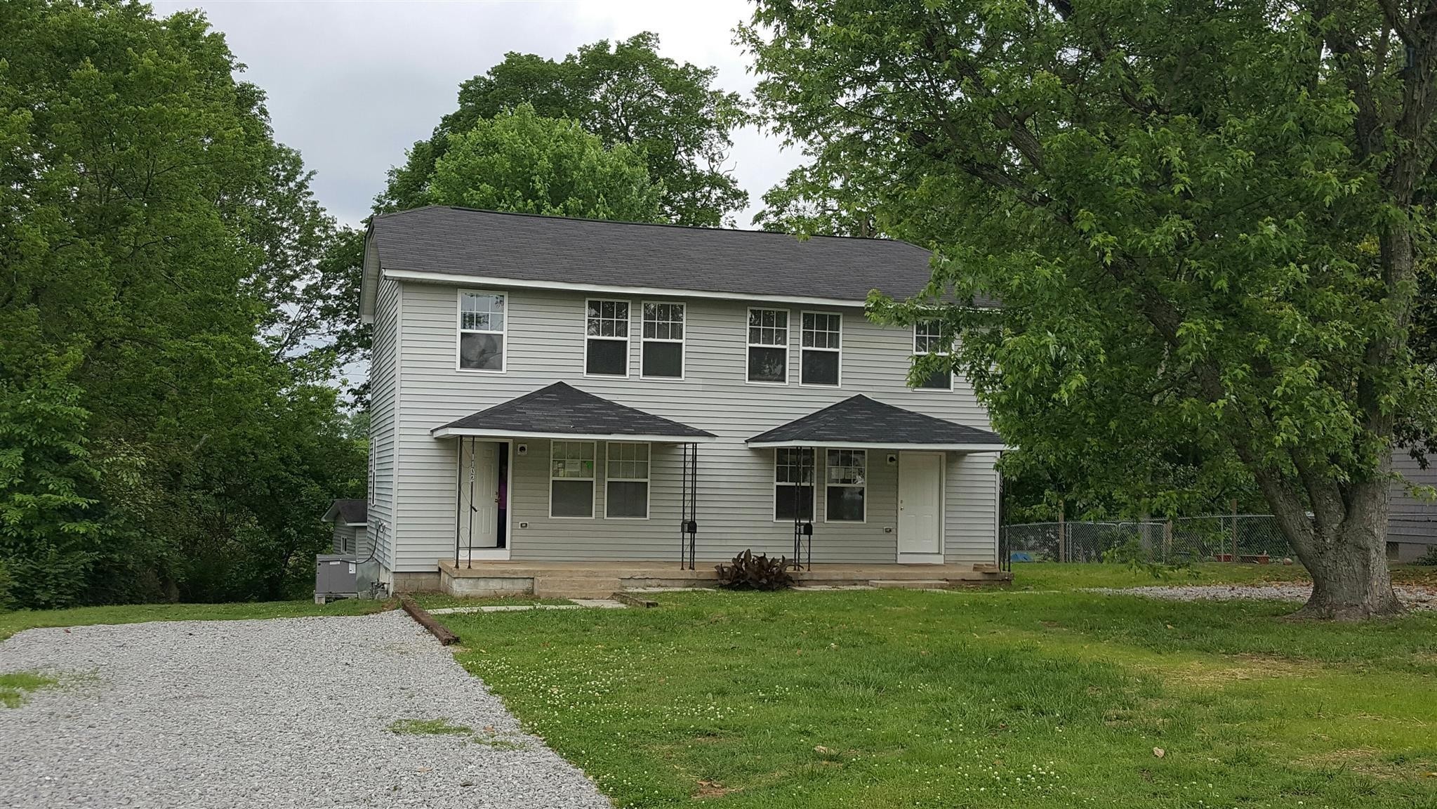 front view of a house and a yard