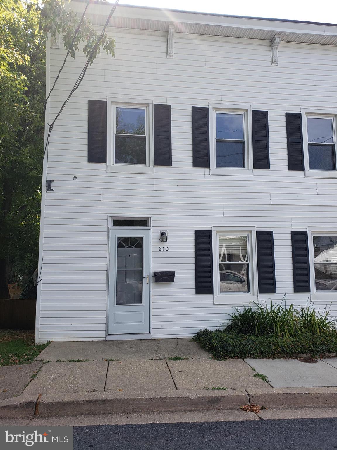 a front view of a building with yard