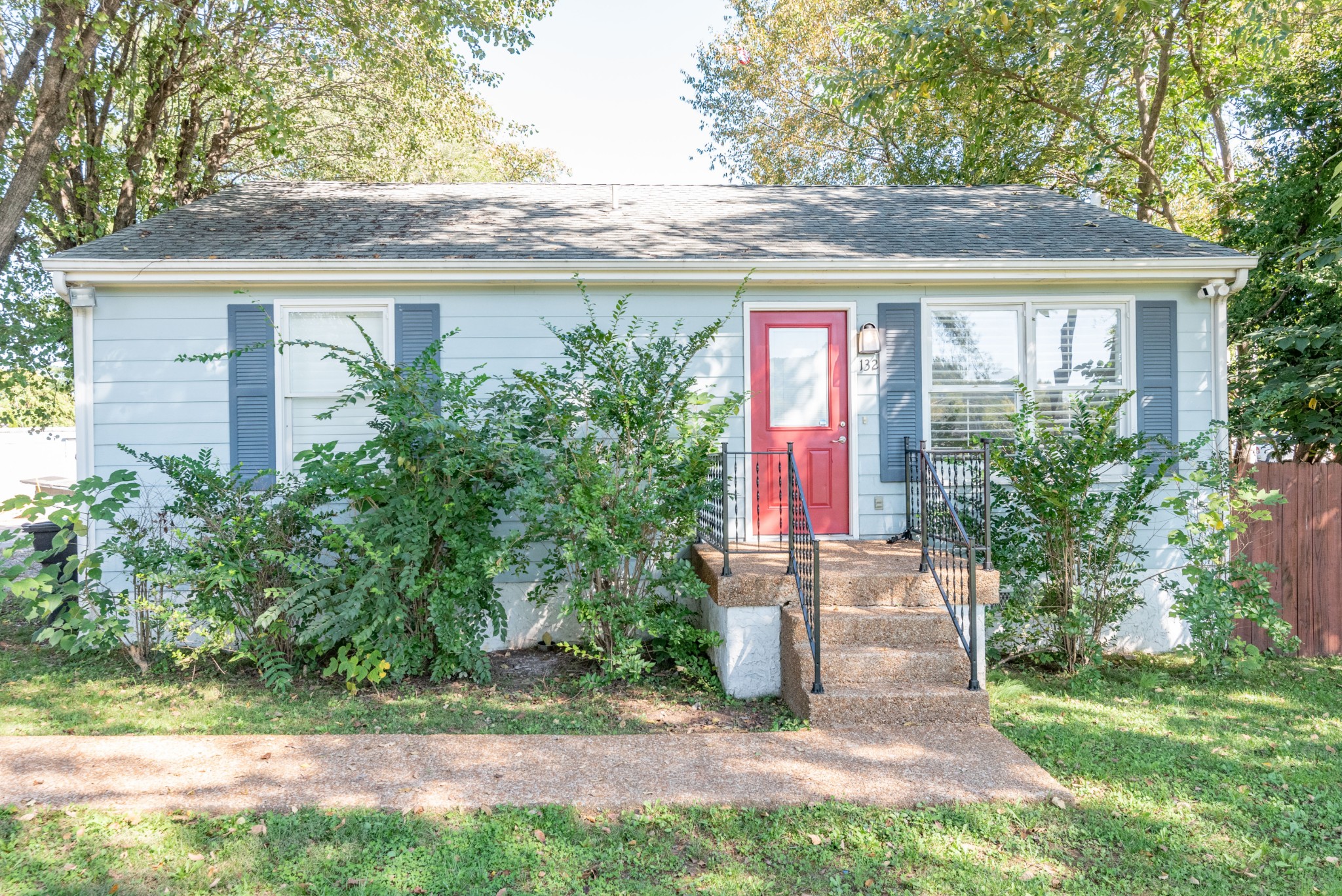 a front view of a house with garden