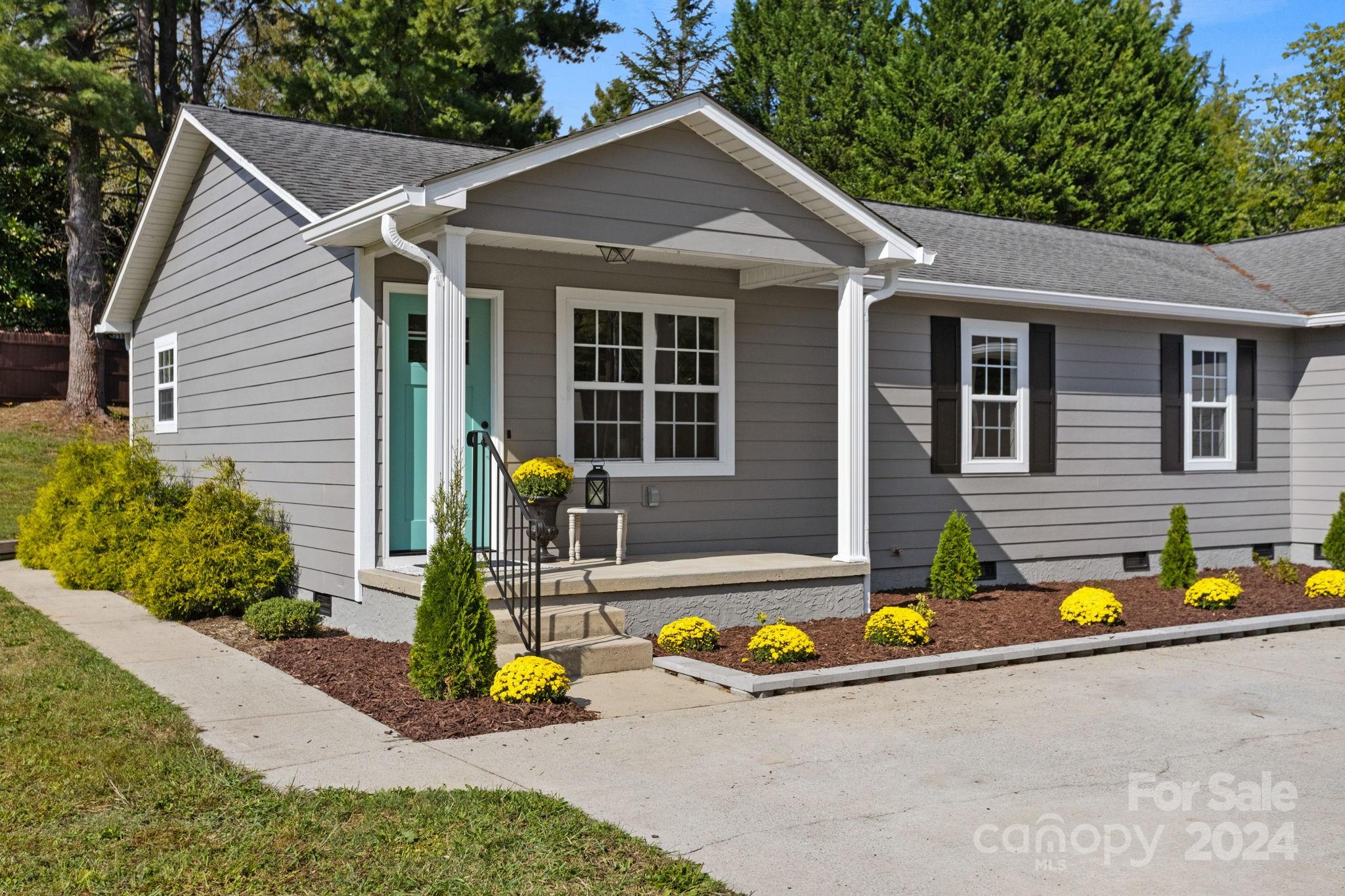 a front view of a house with a yard outdoor seating