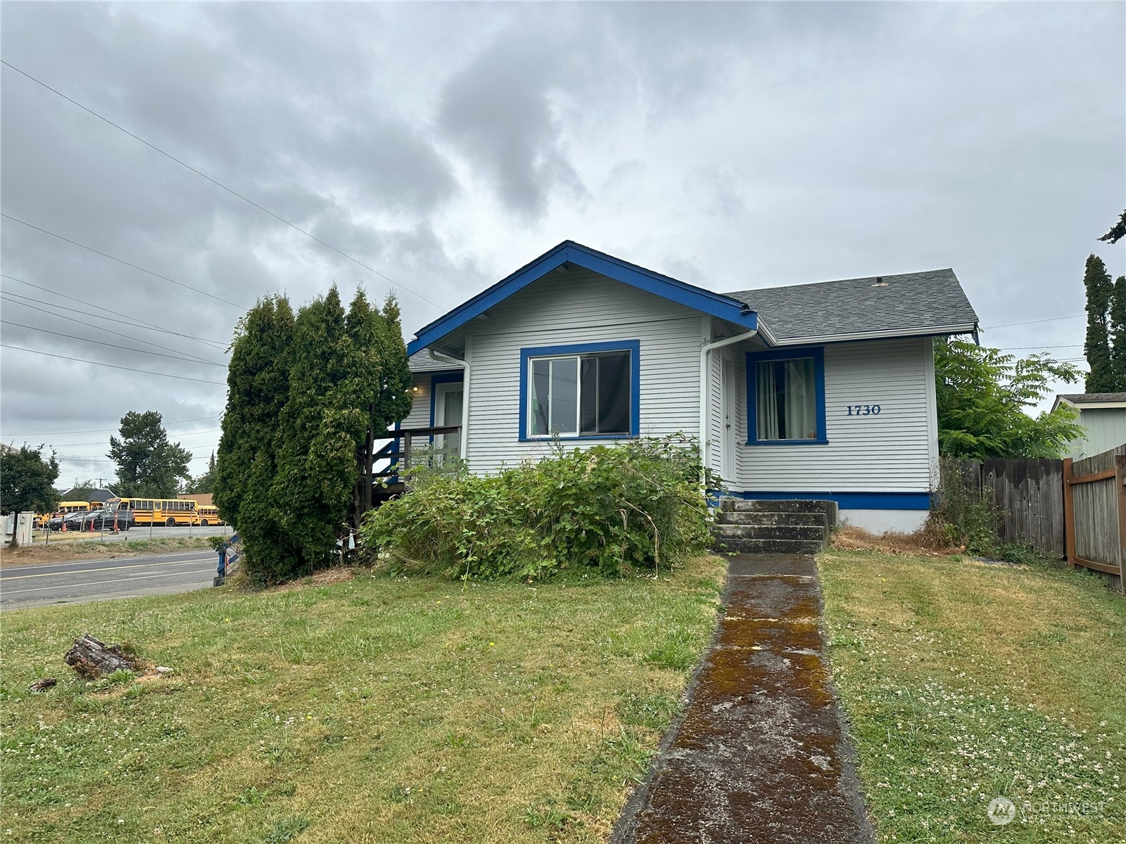 a house with lots of trees in the background