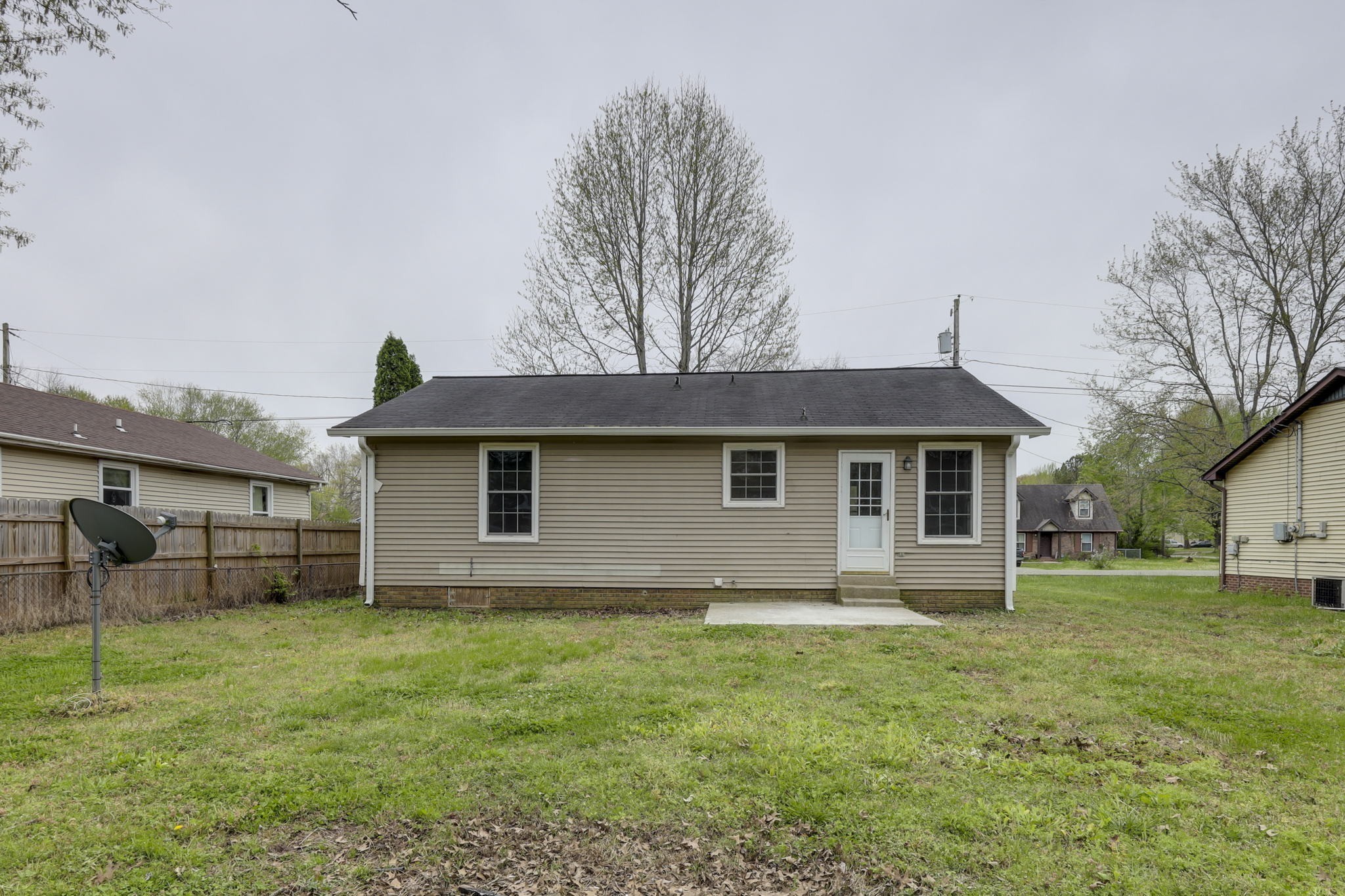 a house with trees in the background