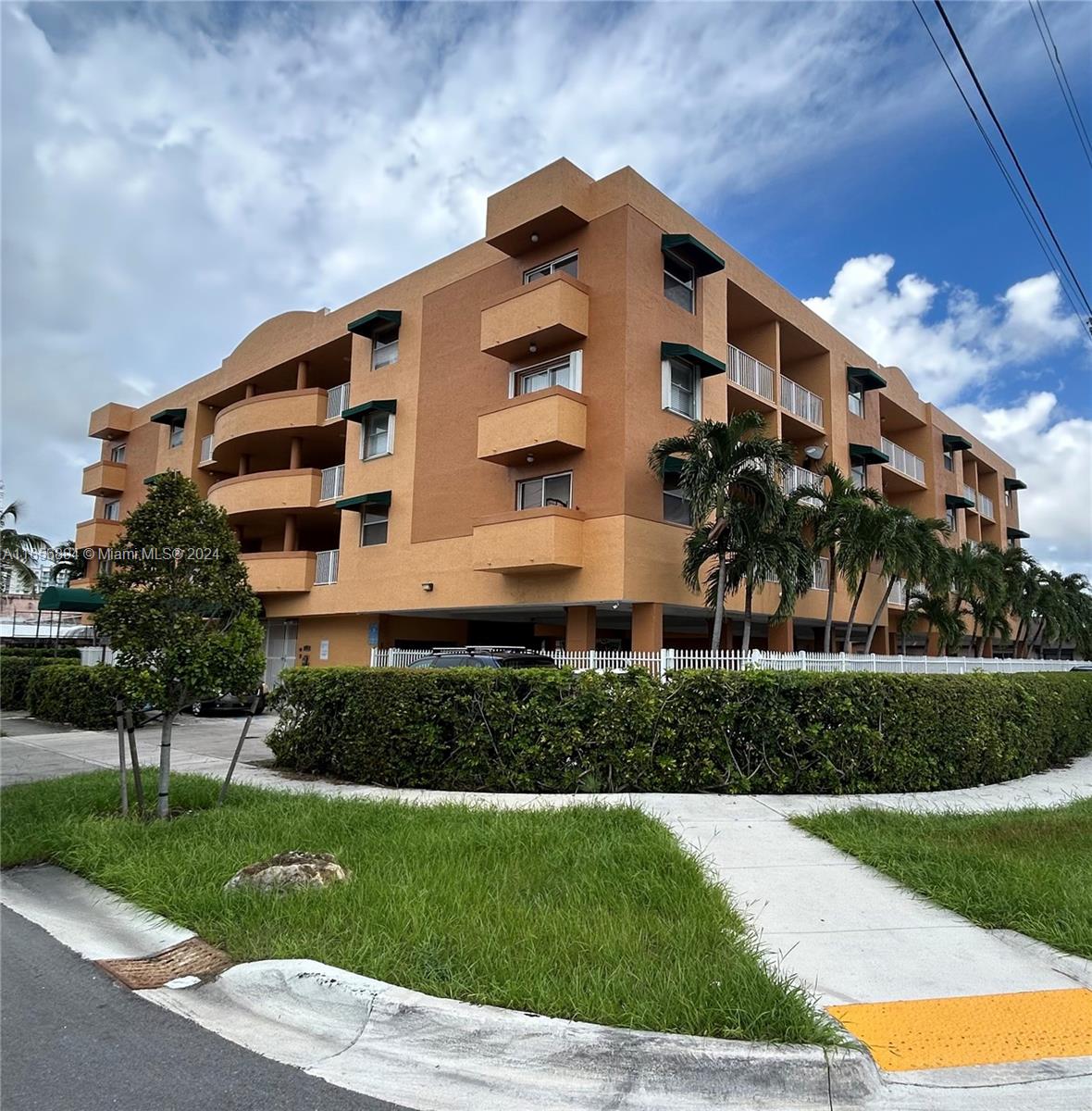 a front view of a building with a yard