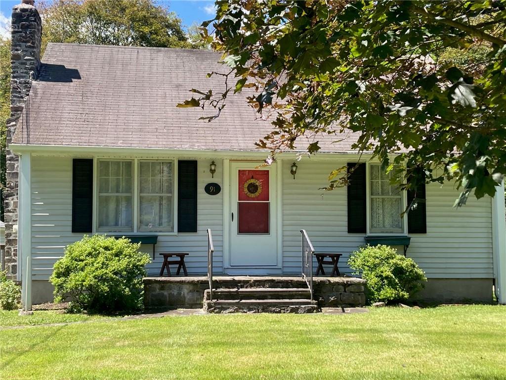 front view of a house with a yard