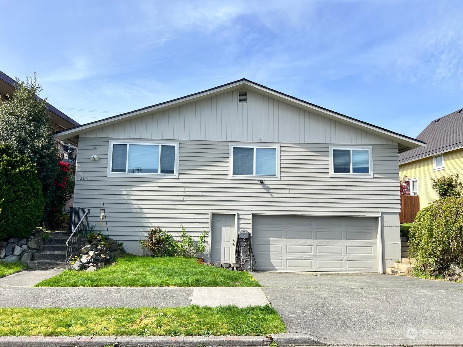 a front view of house with yard and green space