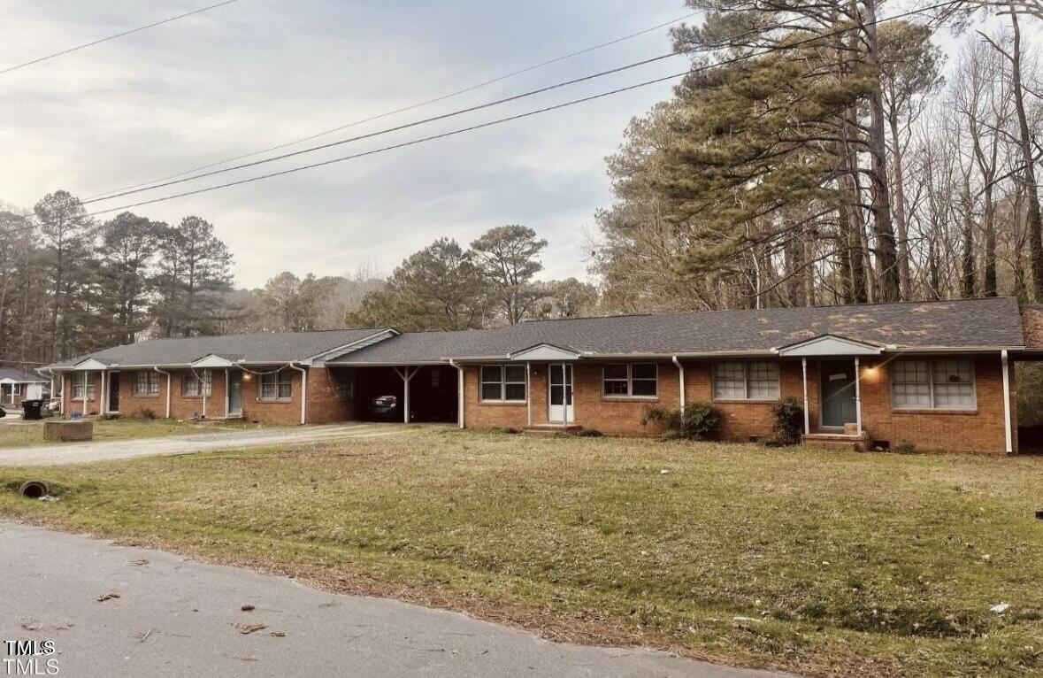 front view of a house with a yard