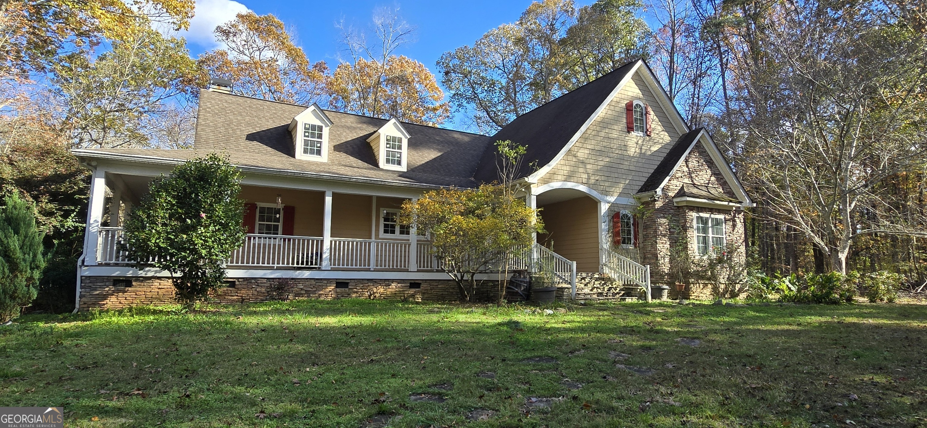 a front view of a house with a yard