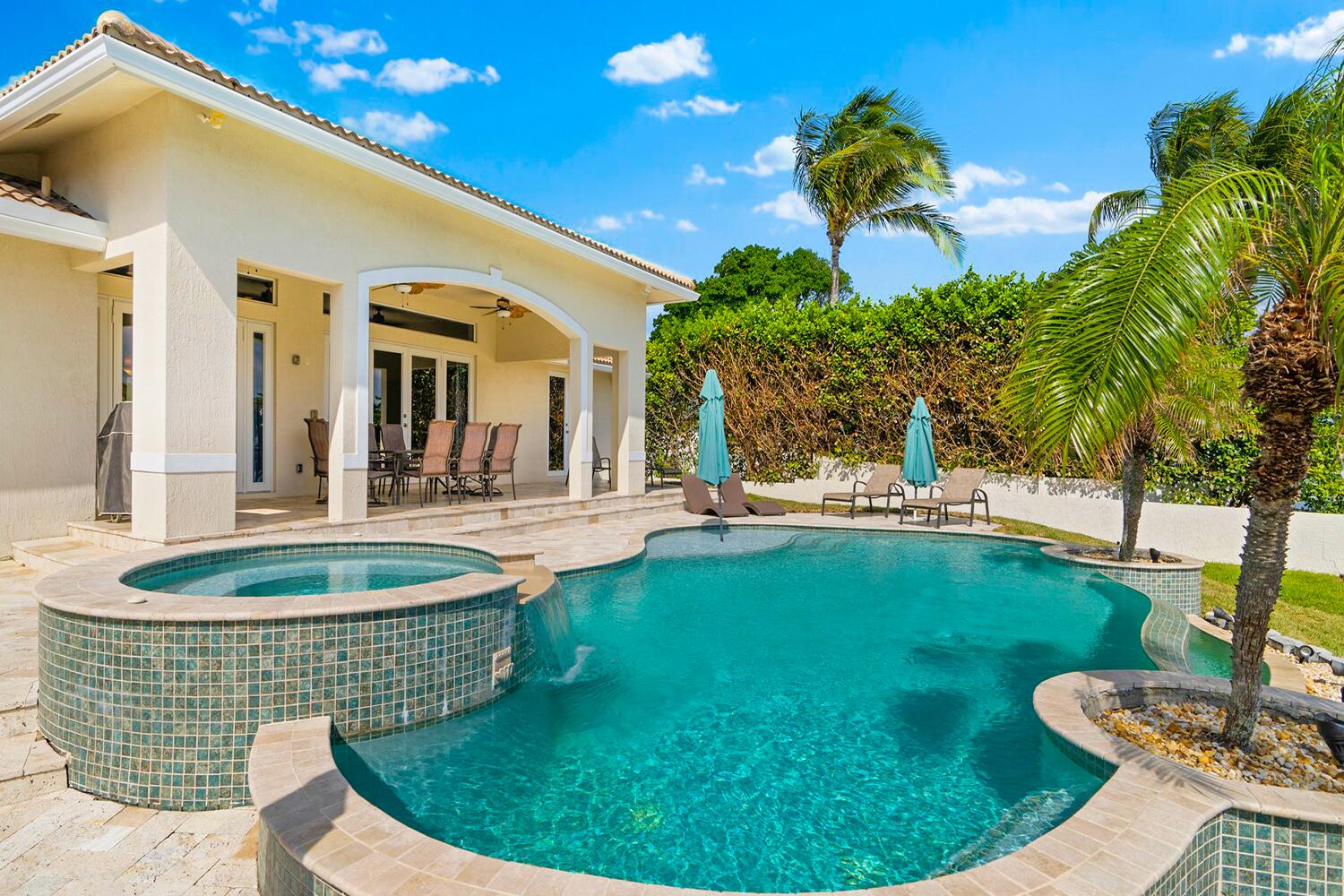 a view of a swimming pool with a patio