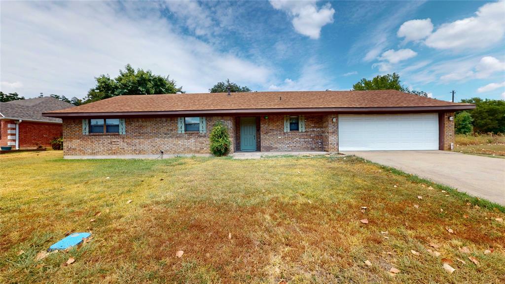 a front view of a house with yard