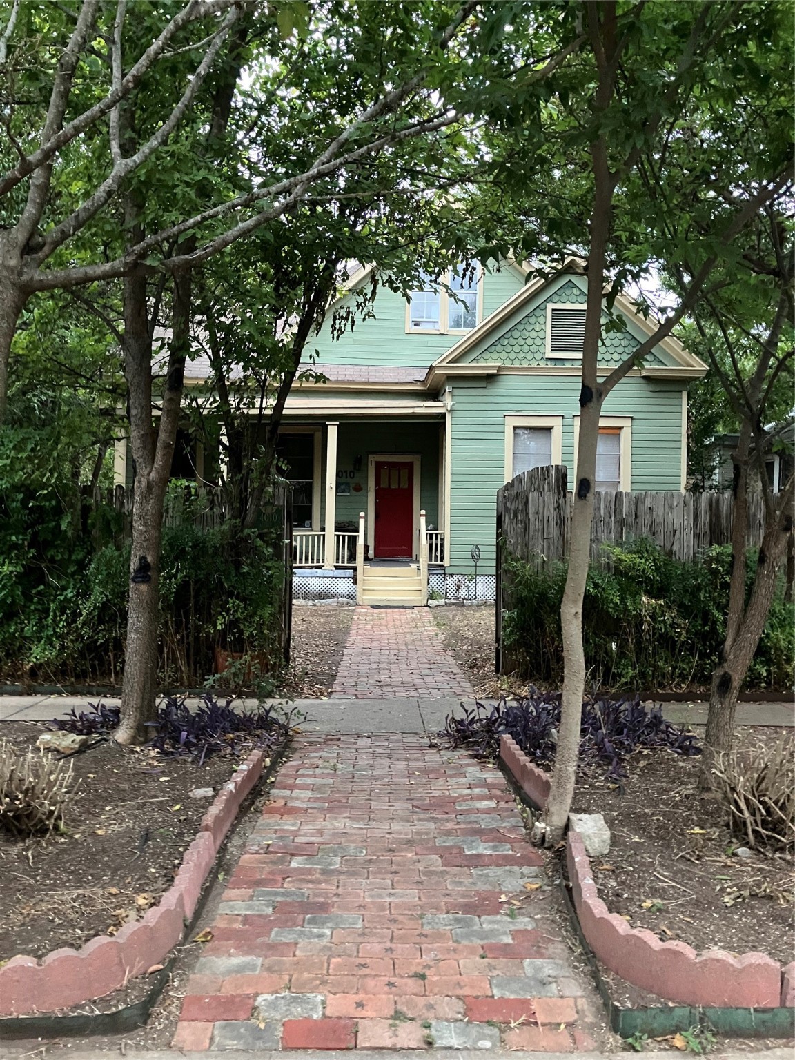 a view of house with yard