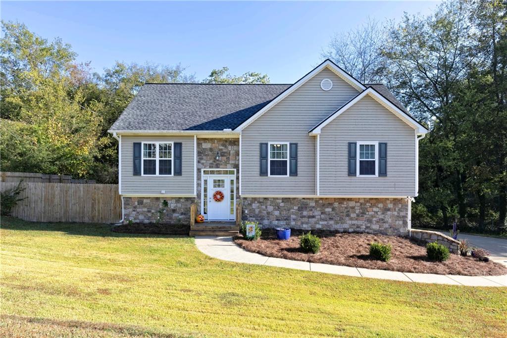 a front view of a house with a yard