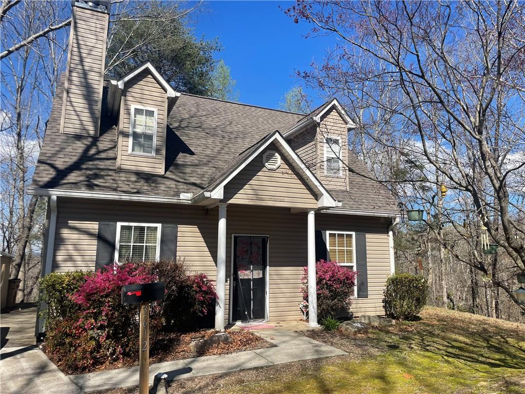 a front view of a house with yard