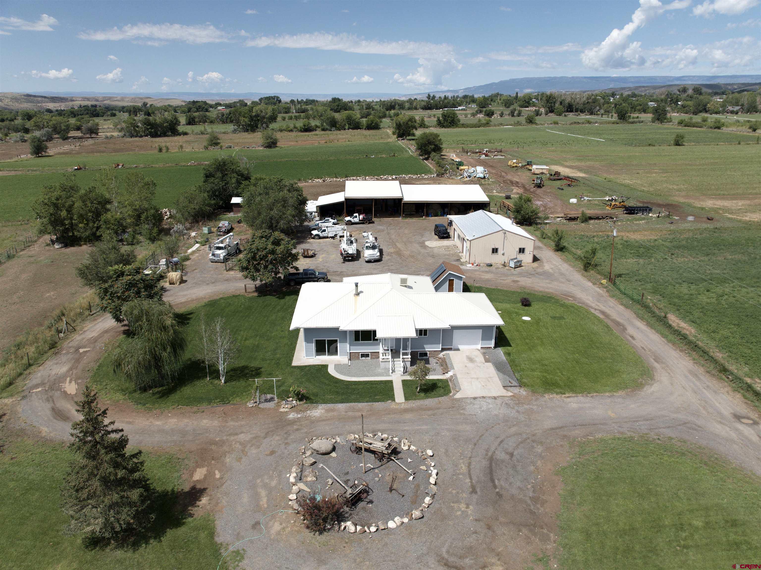 an aerial view of a house with garden space and houses