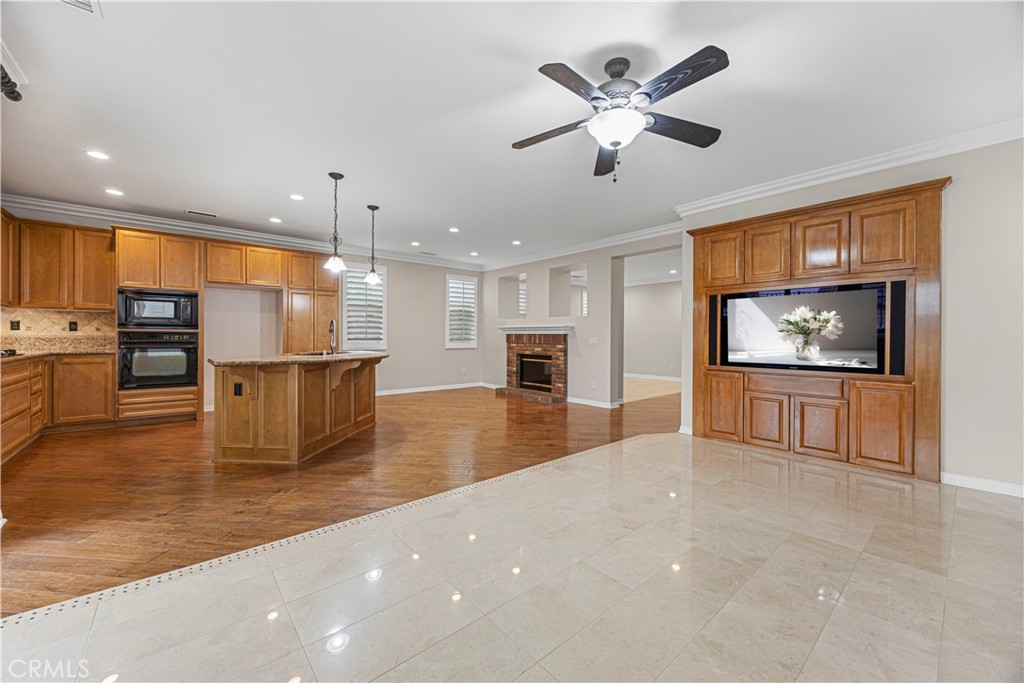 a view of kitchen with furniture and a flat screen tv