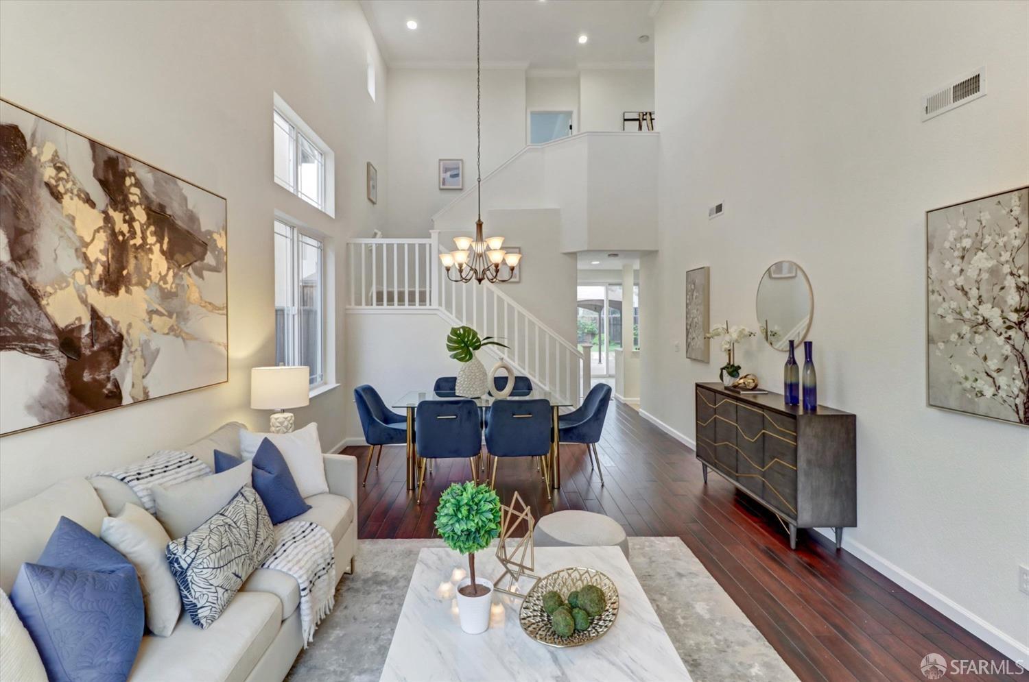 a living room with furniture fireplace and wooden floor