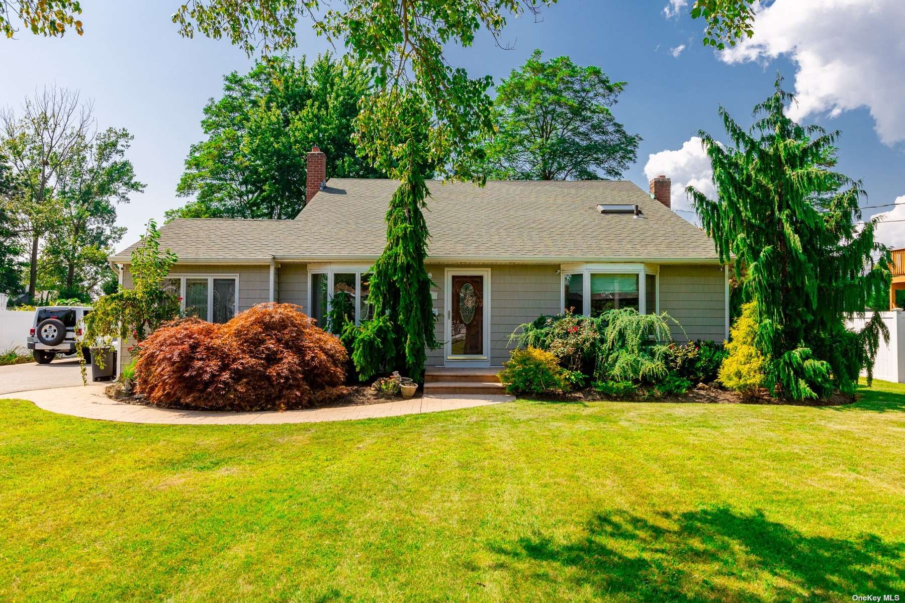 a house view with swimming pool and garden