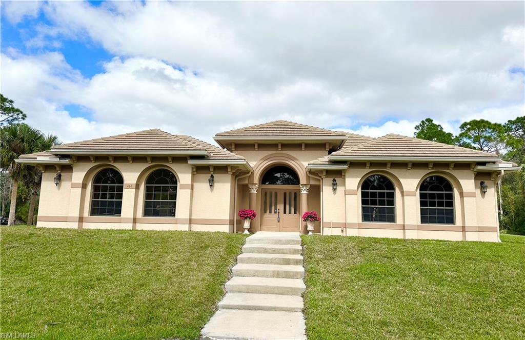 a front view of a house with a yard