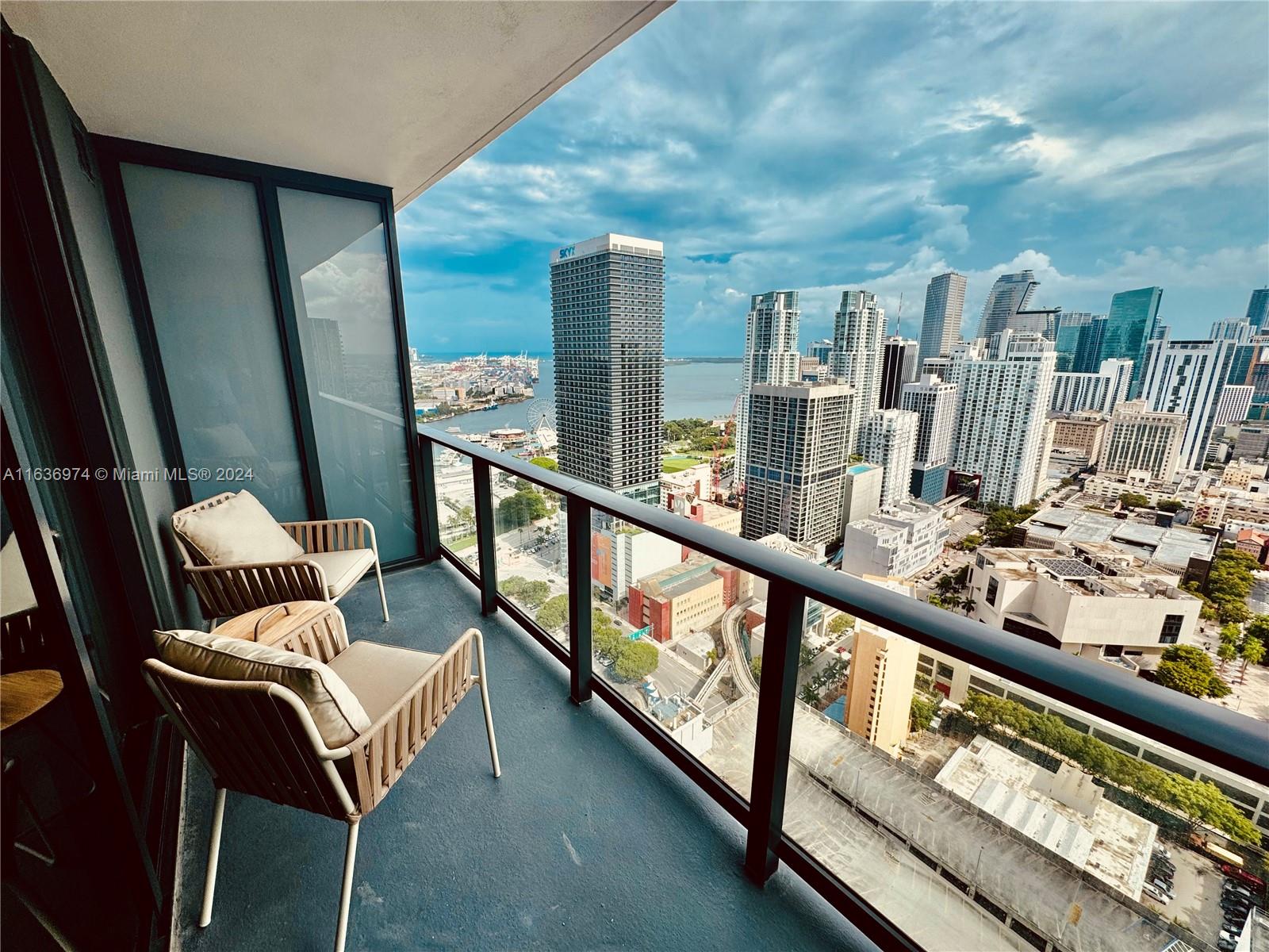 a view of a balcony with furniture