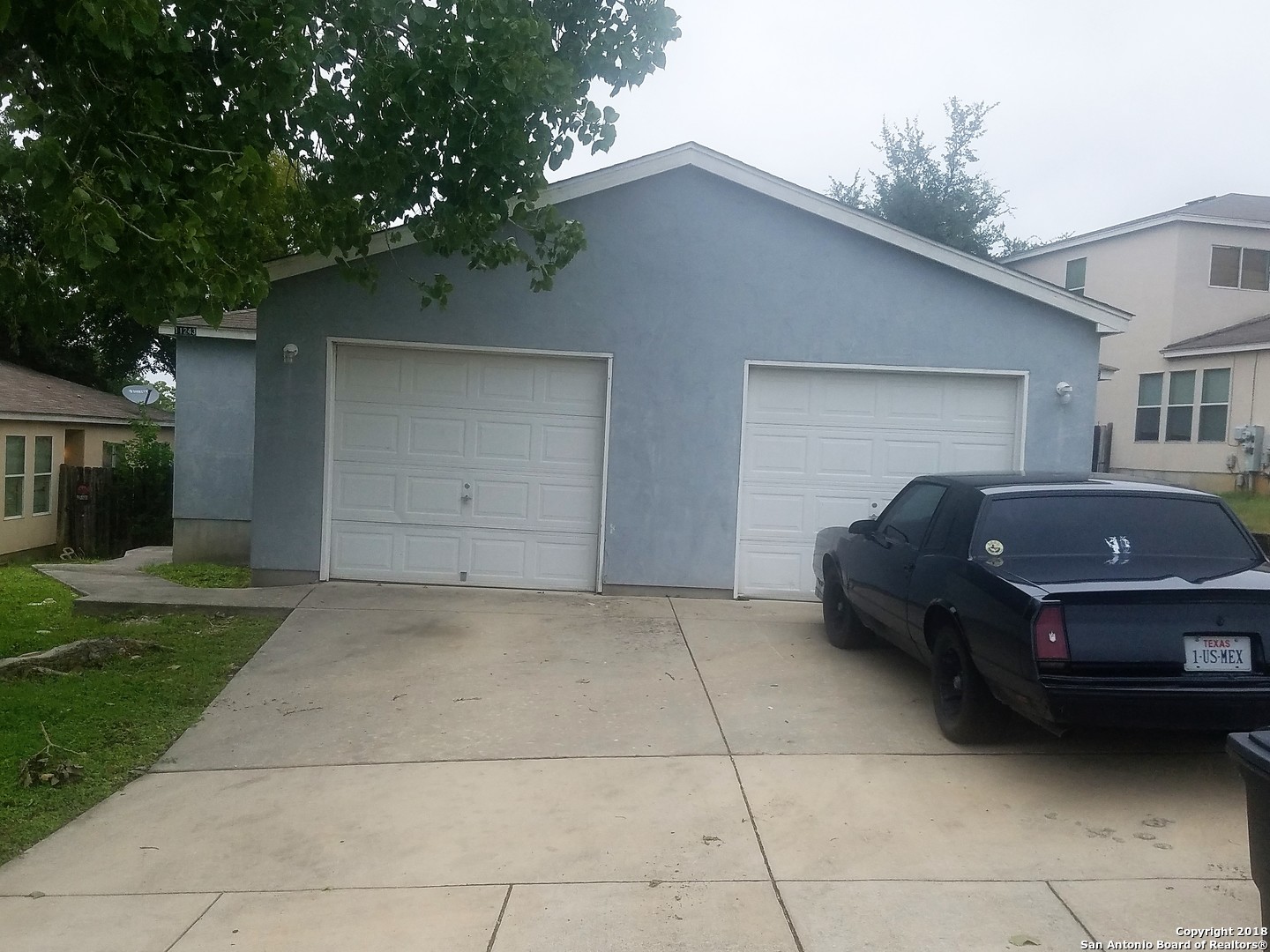 a car parked in front of a house