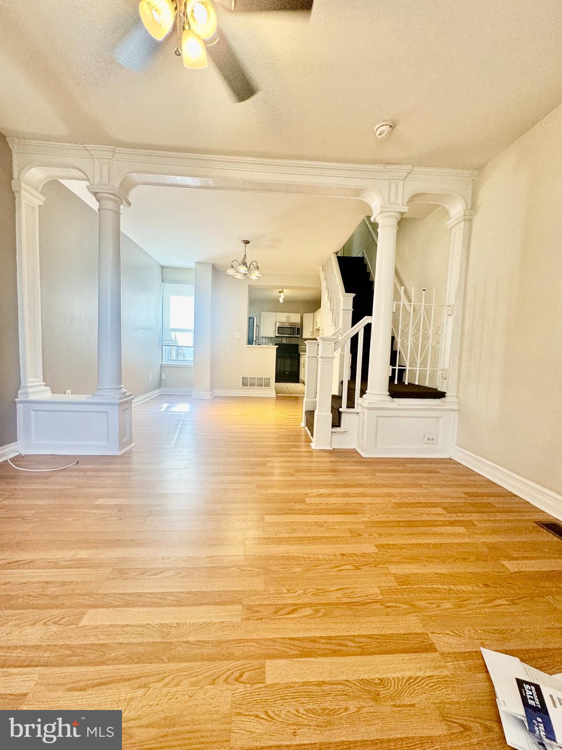 a view of a living room with kitchen