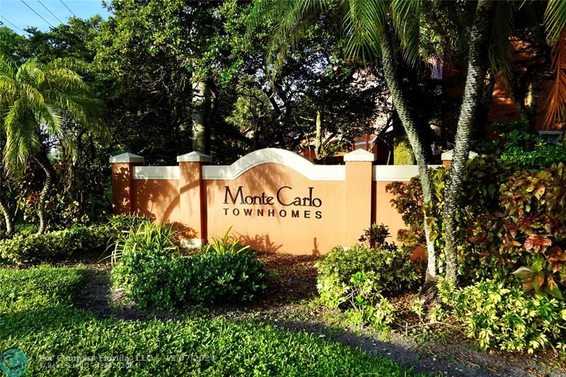 a view of outdoor space with signage and flags