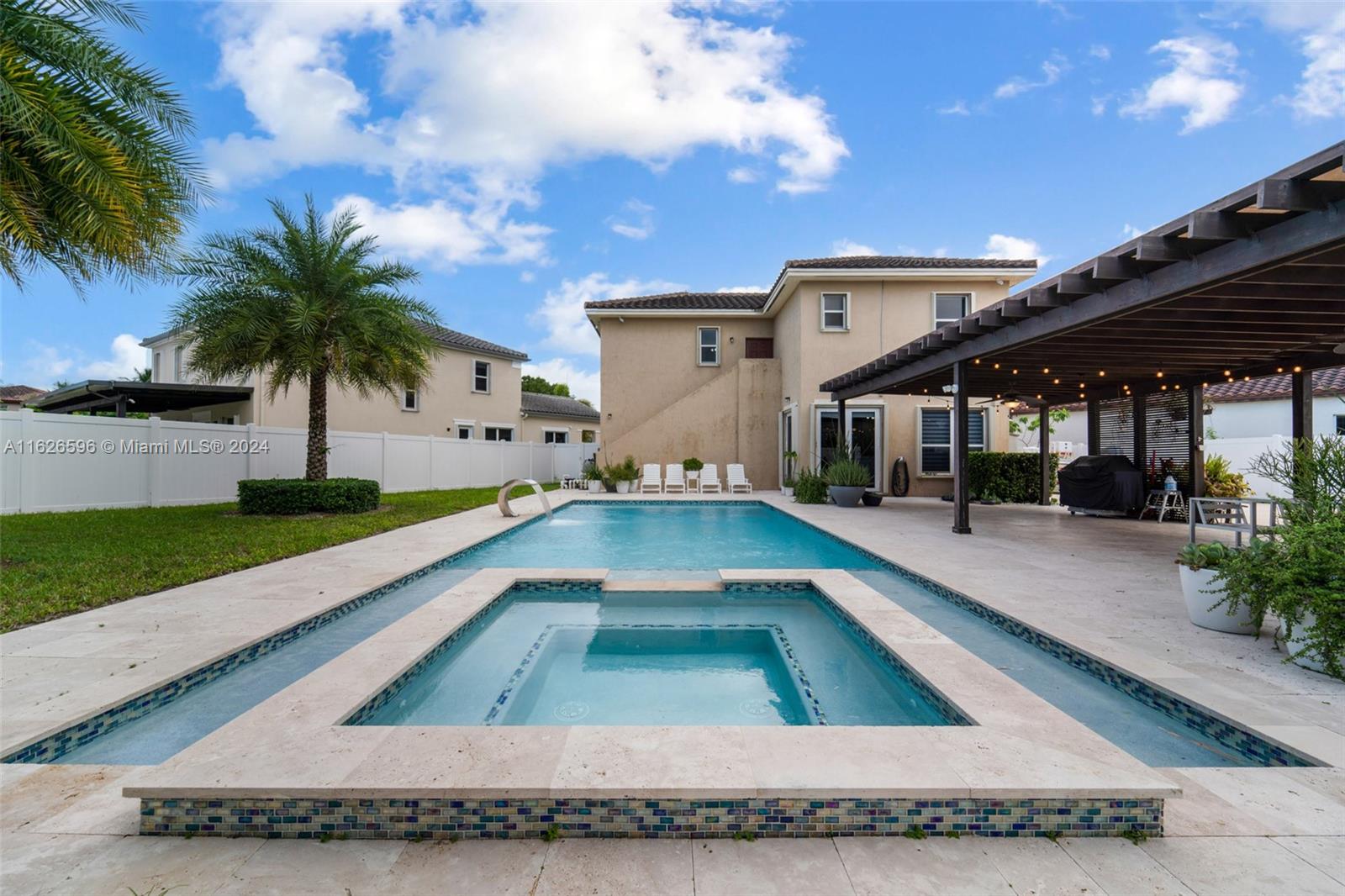 a view of a house with swimming pool