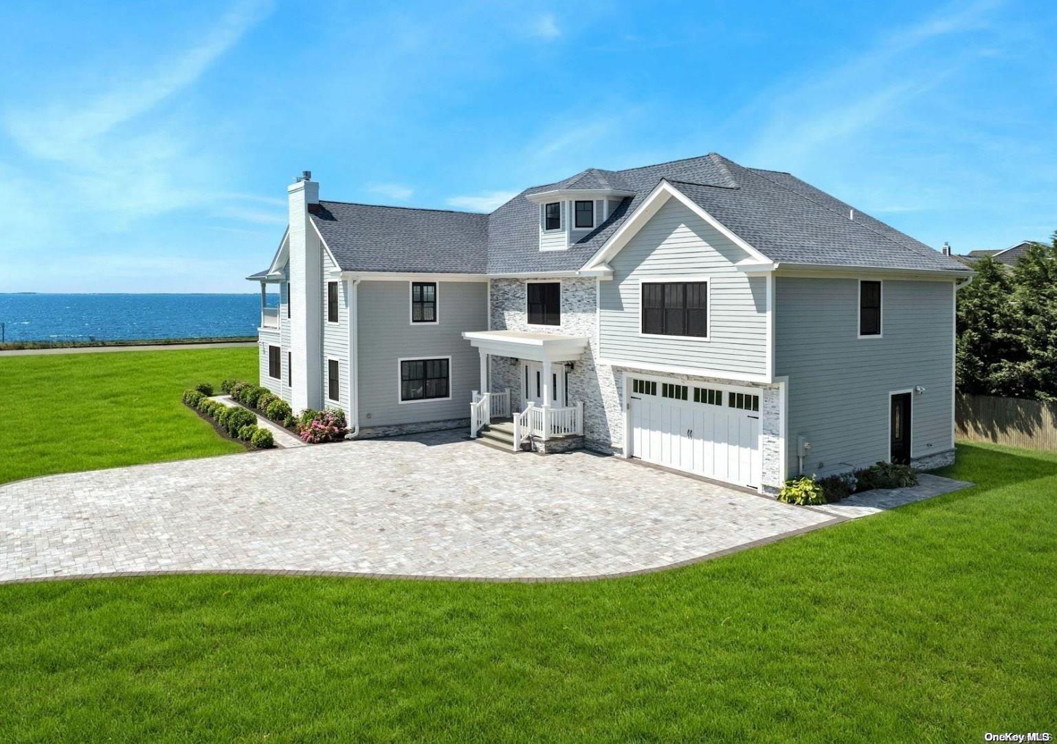 a view of a house with a yard and deck