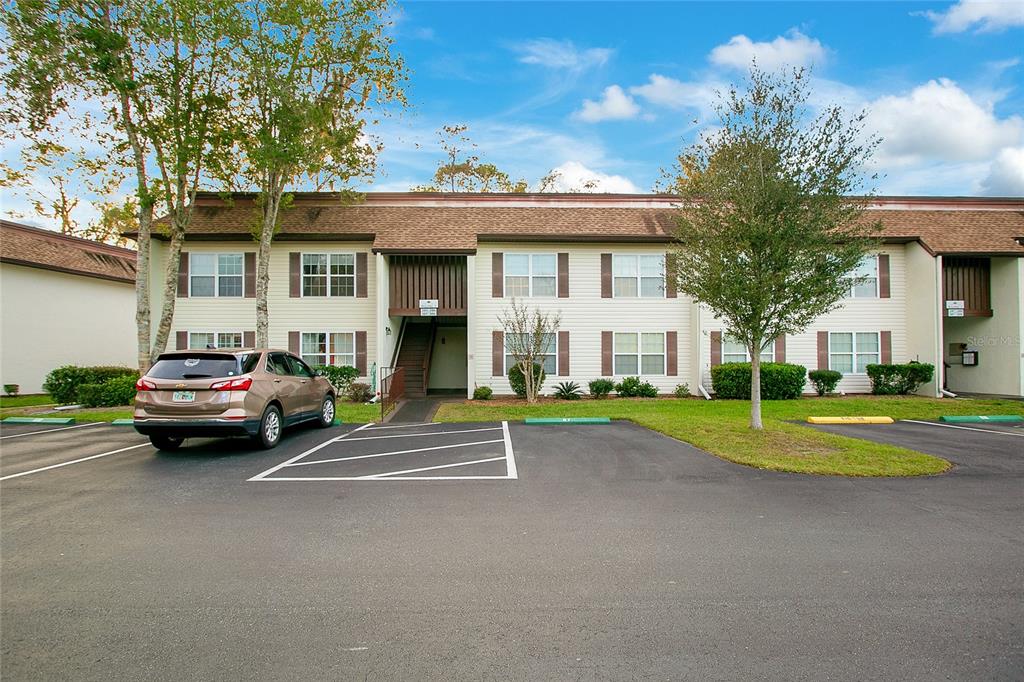 a view of a car park in front of house