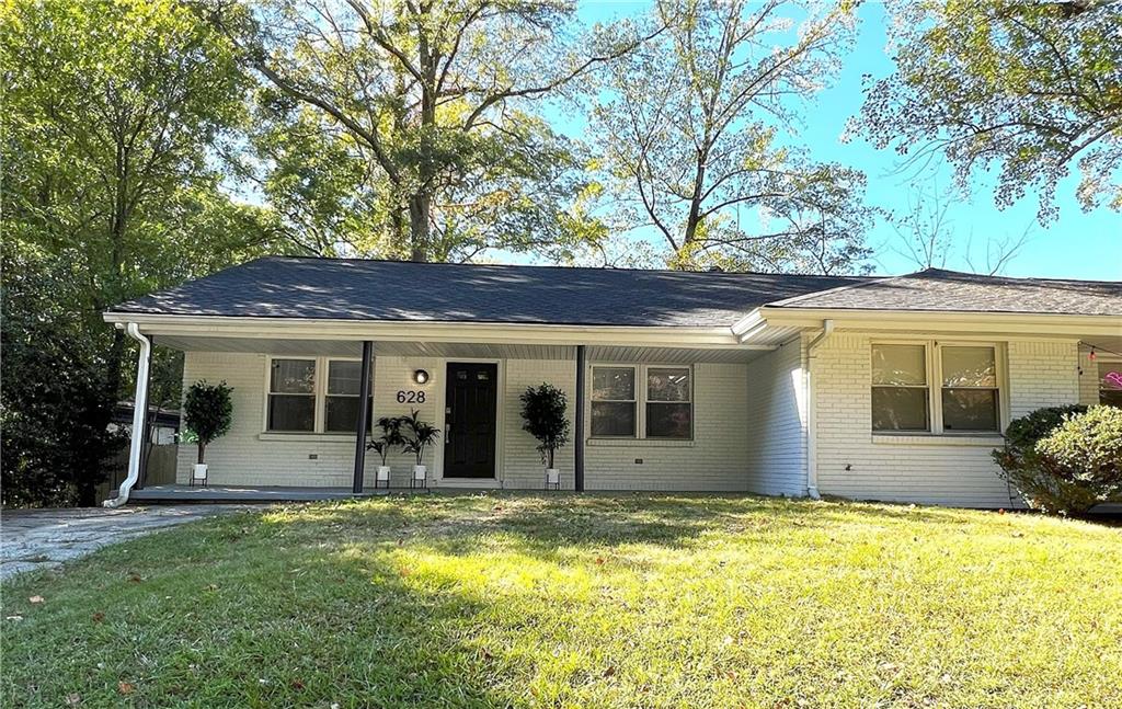 front view of a house with a yard