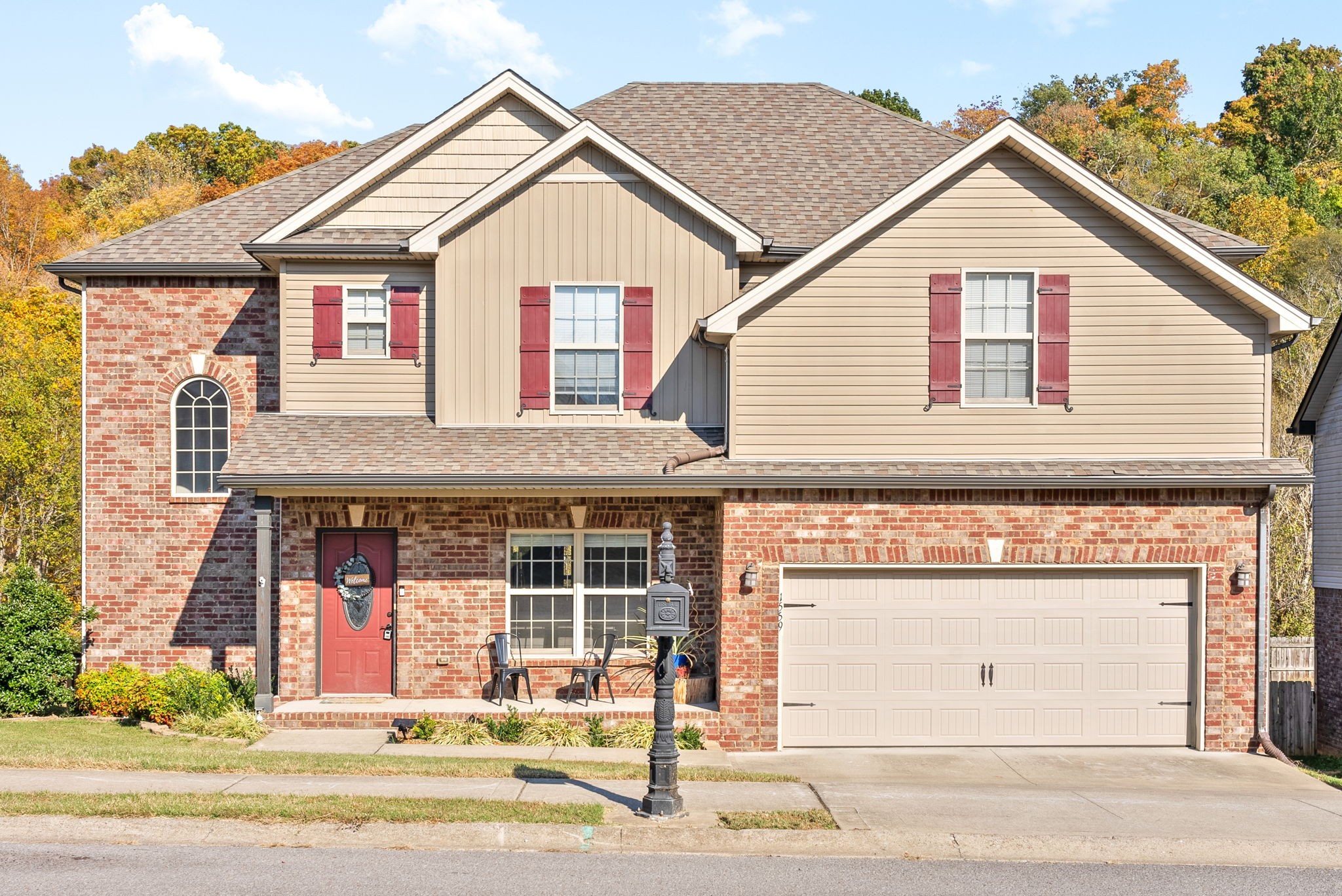 a front view of a house with a yard