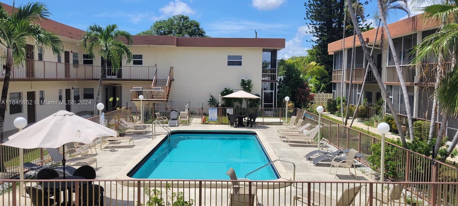 a view of swimming pool with outdoor seating