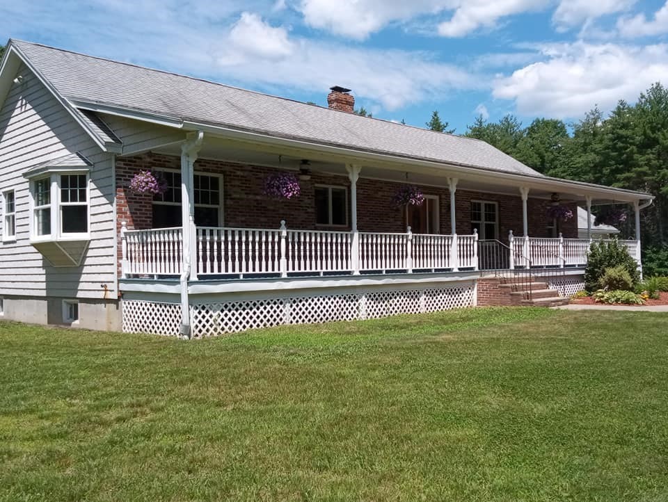 a front view of a house with a garden