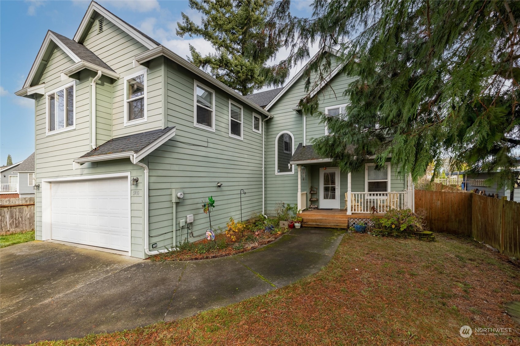 a front view of a house with yard