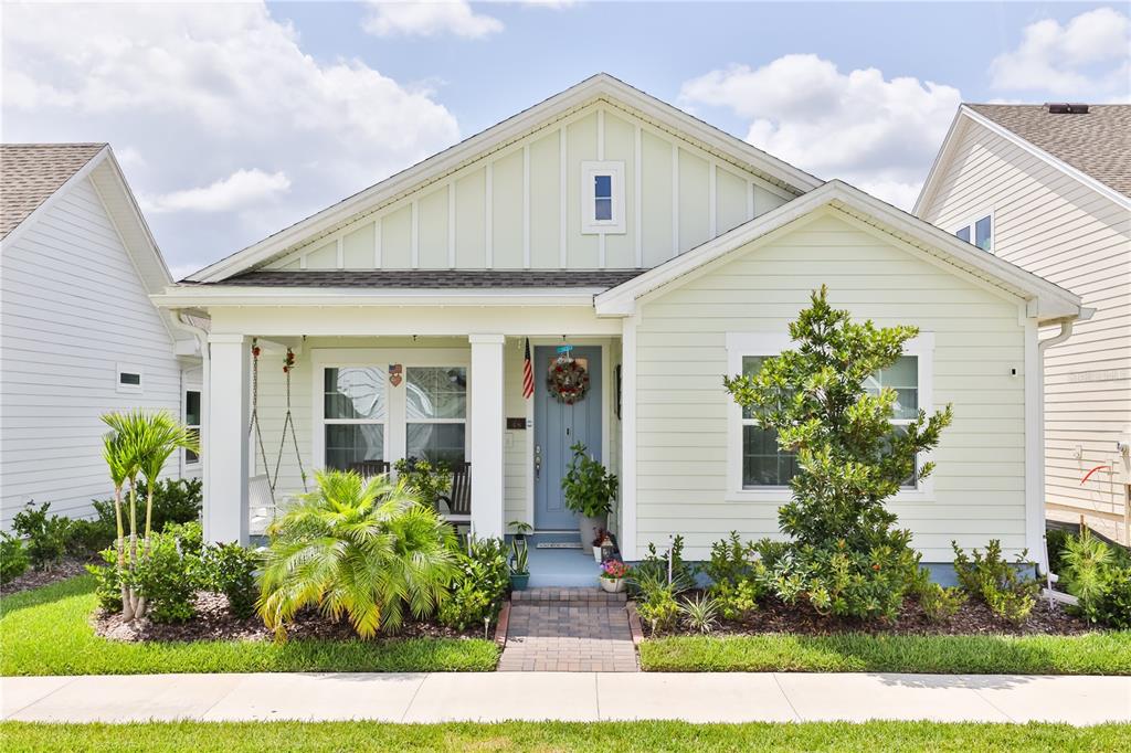 a front view of house with yard and green space